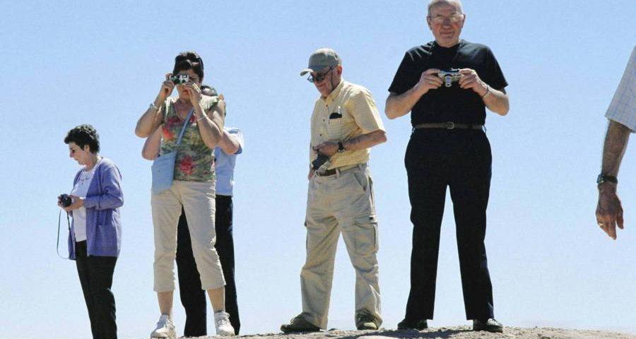 Tourists On A Moroccan Well